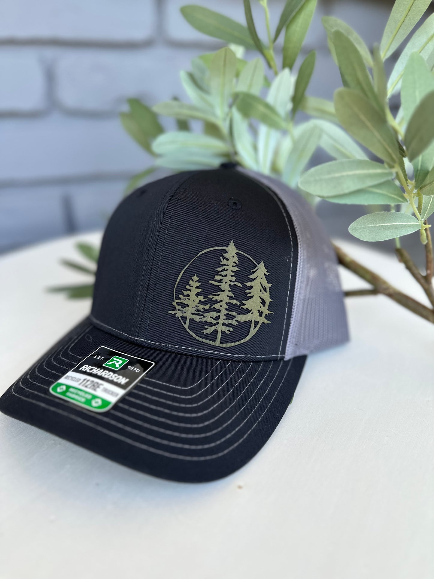 Trucker hat with 3 trees leather patch