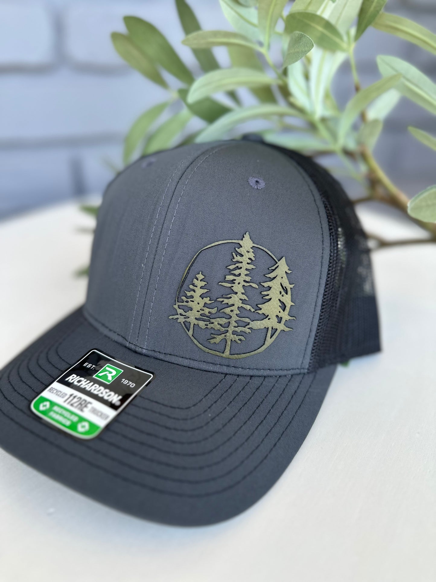 Trucker hat with 3 trees leather patch