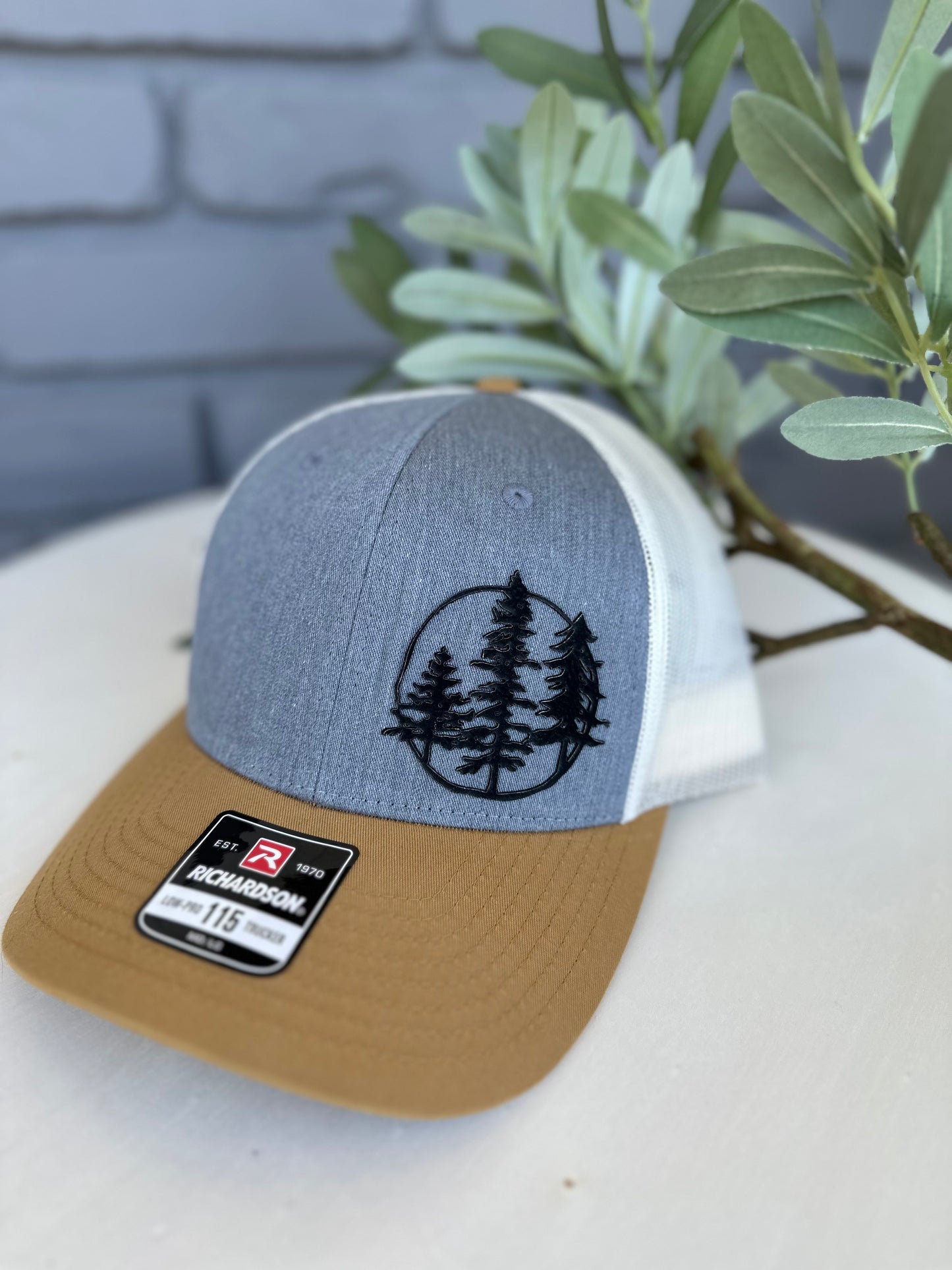 Trucker hat with 3 trees leather patch