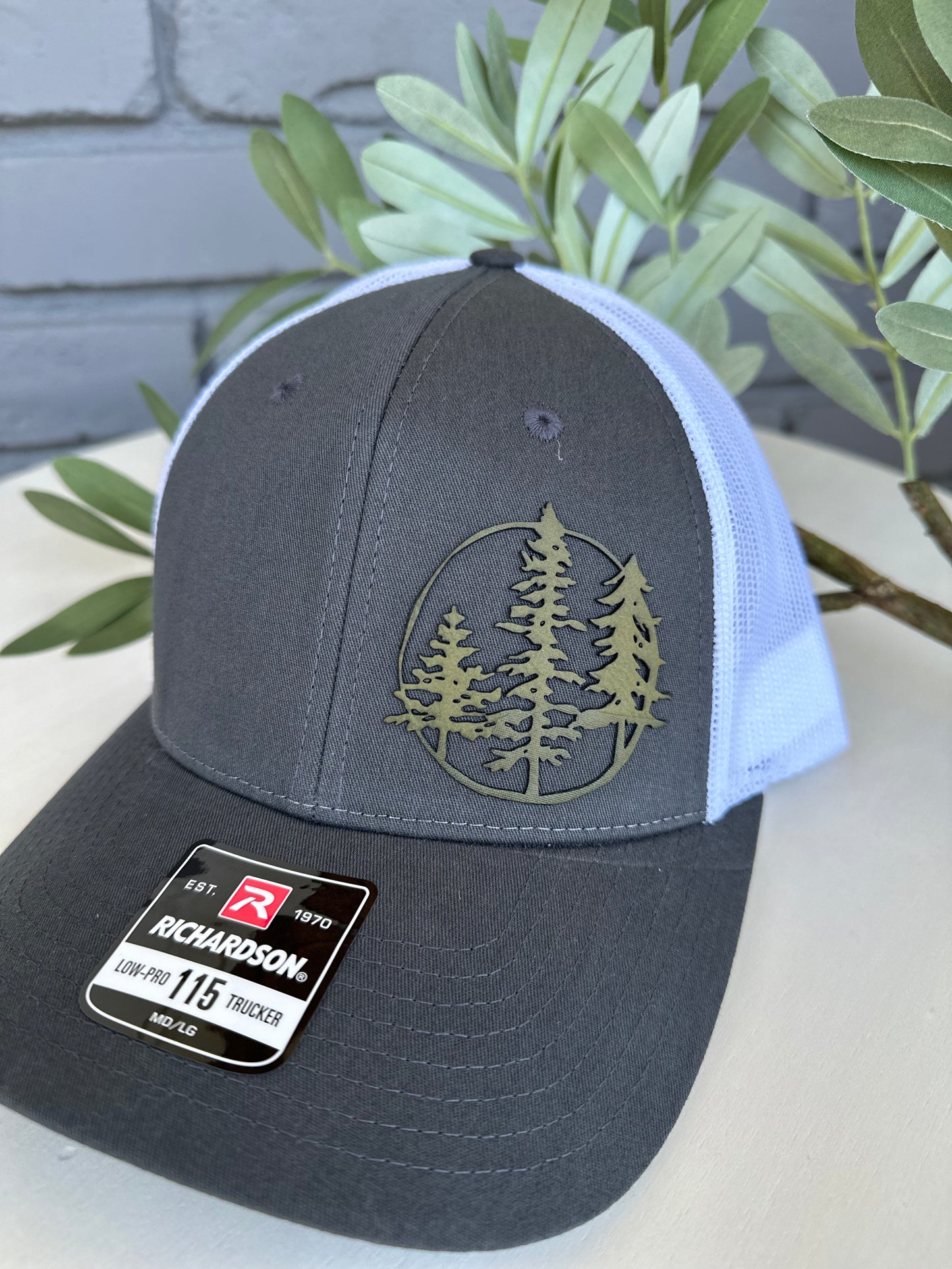 Trucker hat with 3 trees leather patch