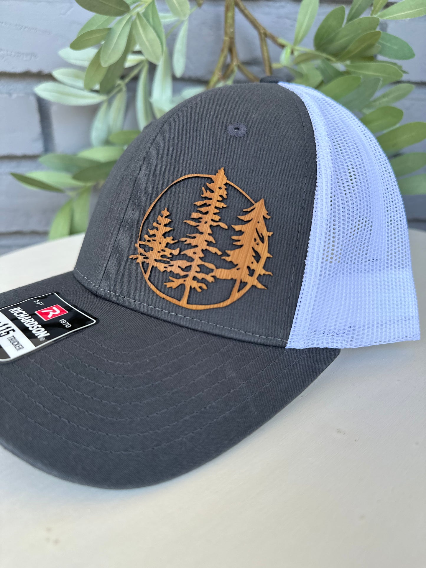 Trucker hat with 3 trees leather patch