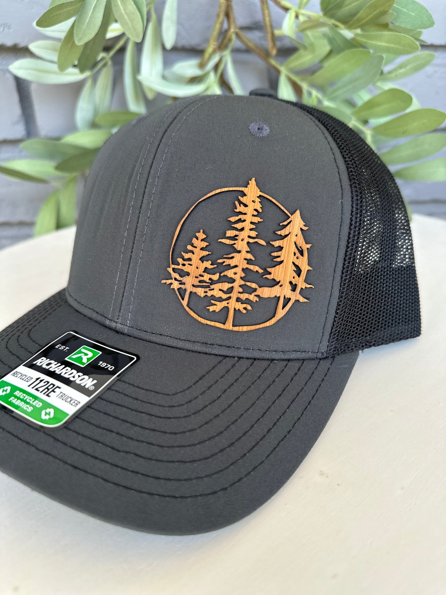 Trucker hat with 3 trees leather patch