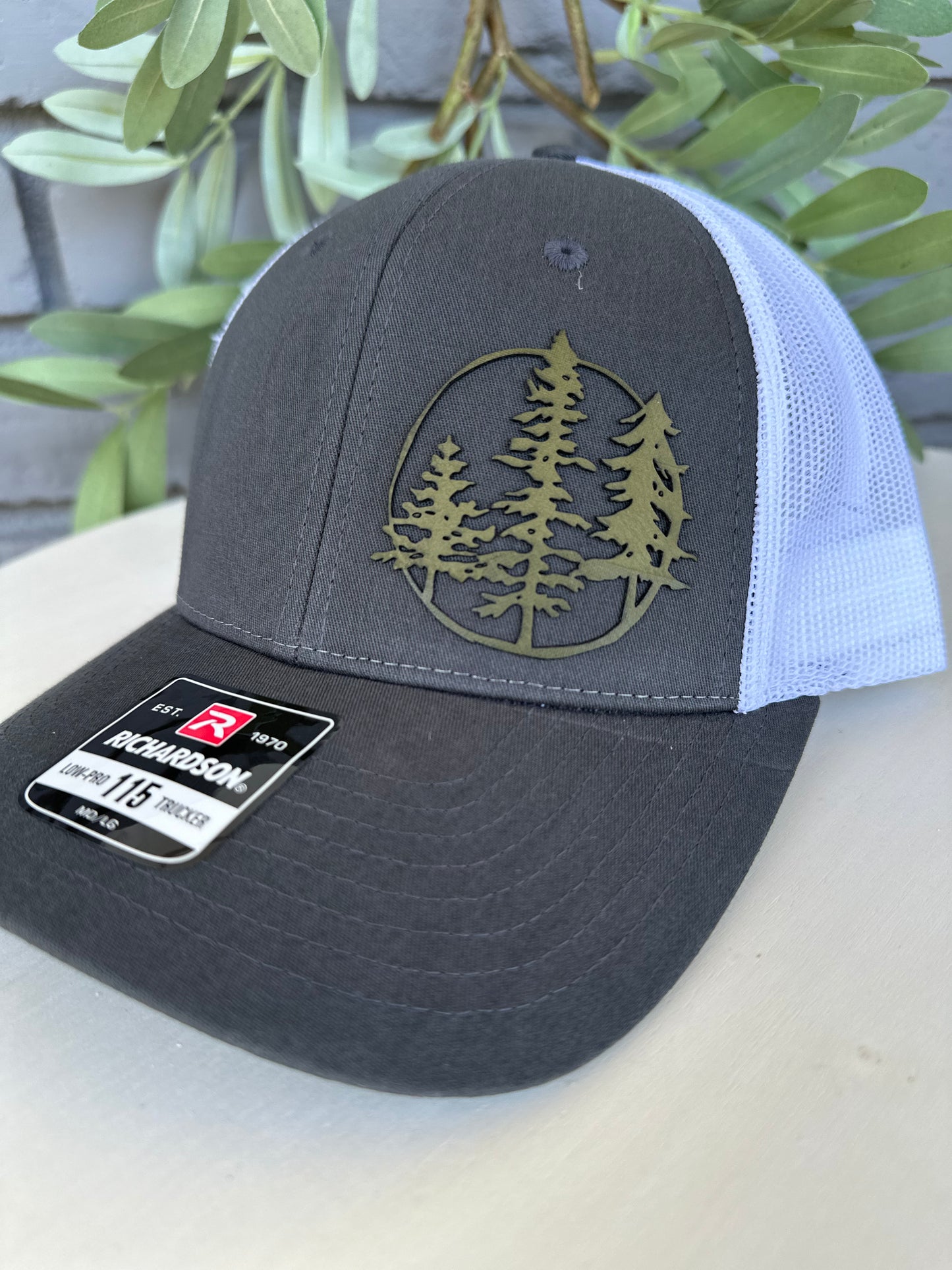 Trucker hat with 3 trees leather patch