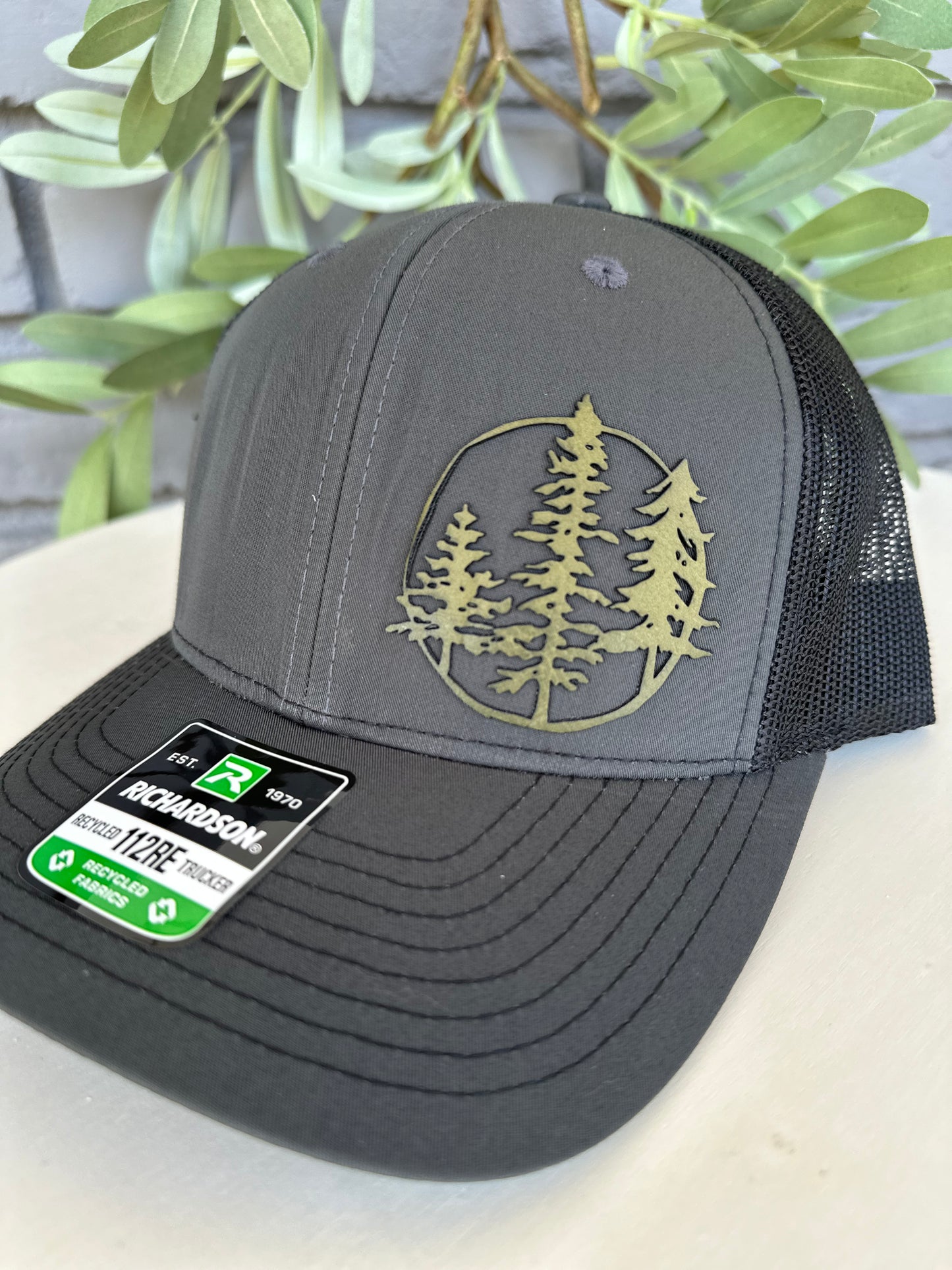 Trucker hat with 3 trees leather patch