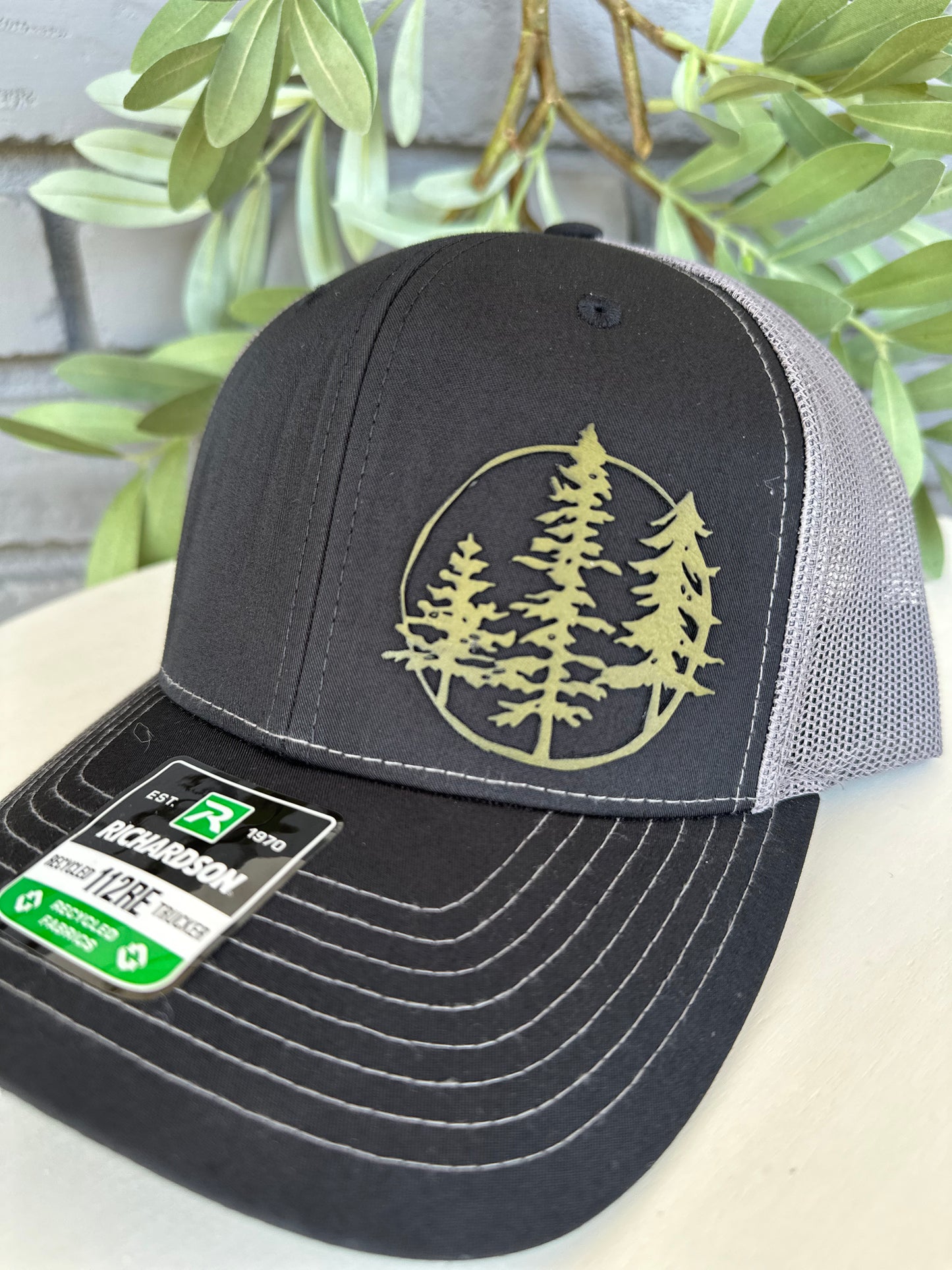 Trucker hat with 3 trees leather patch