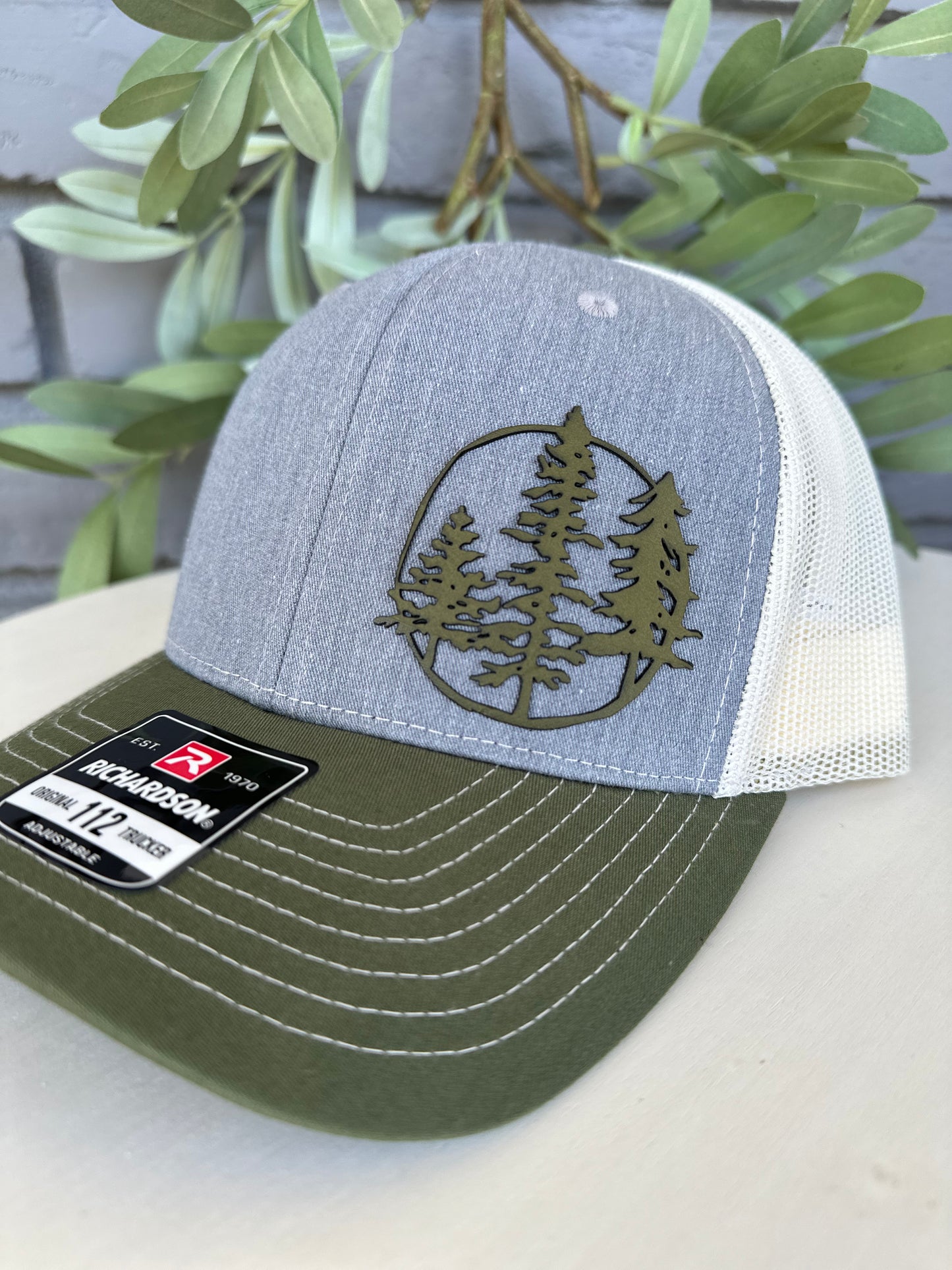 Trucker hat with 3 trees leather patch