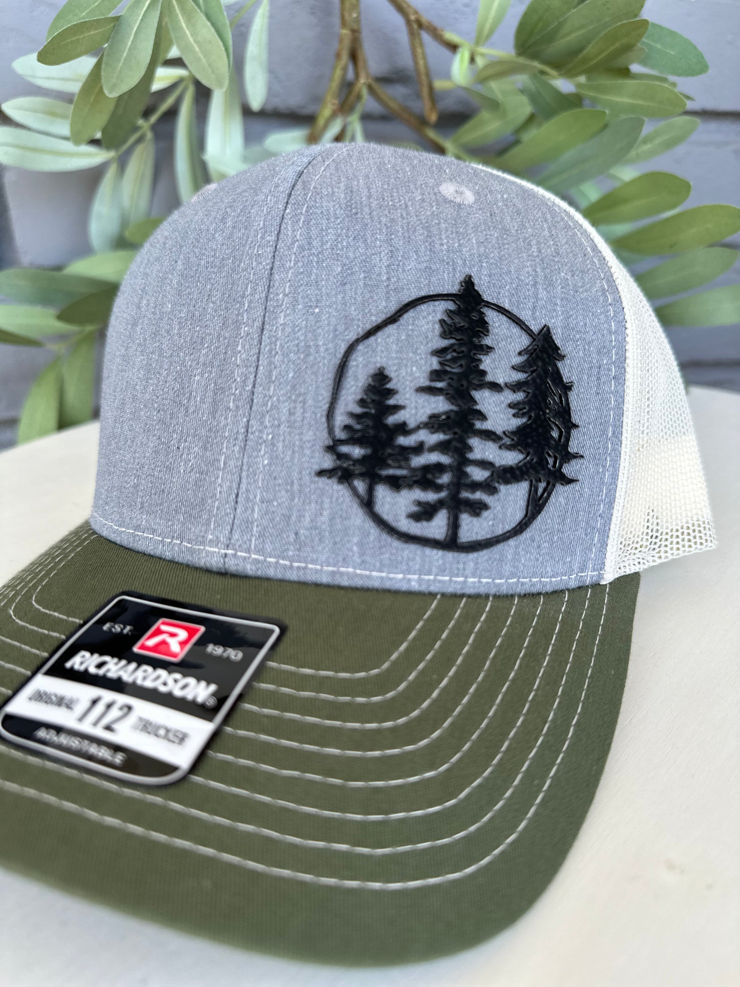 Trucker hat with 3 trees leather patch