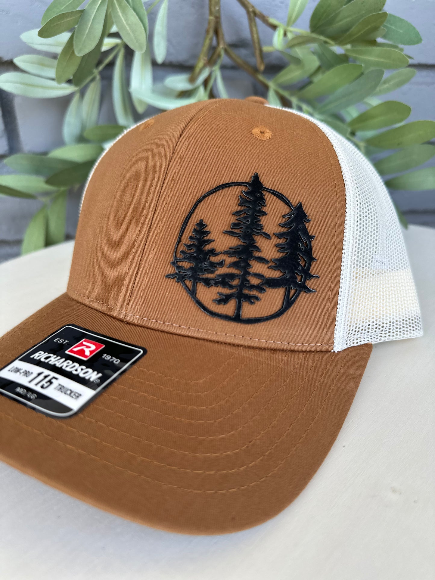 Trucker hat with 3 trees leather patch