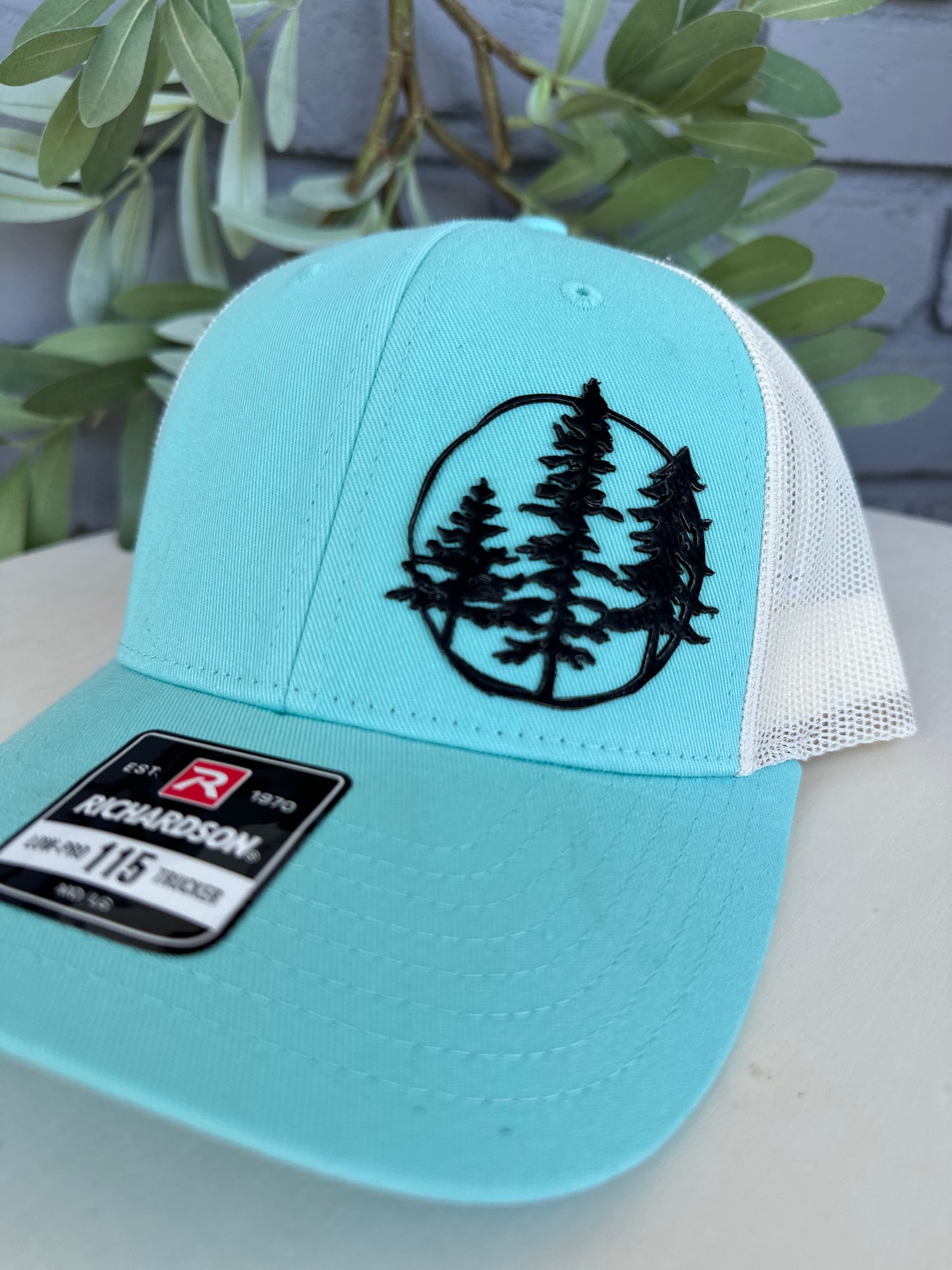 Trucker hat with 3 trees leather patch